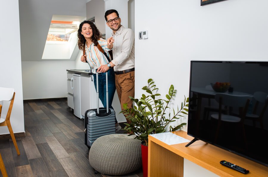 Couple checking into a modern vacation rental