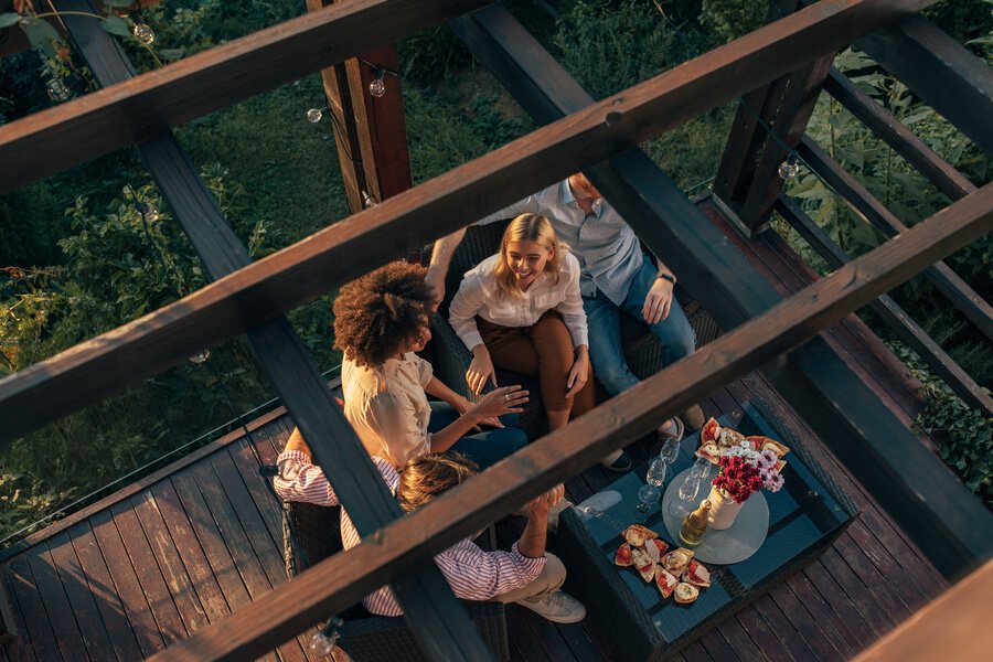Friends enjoying a rooftop gathering in nature
