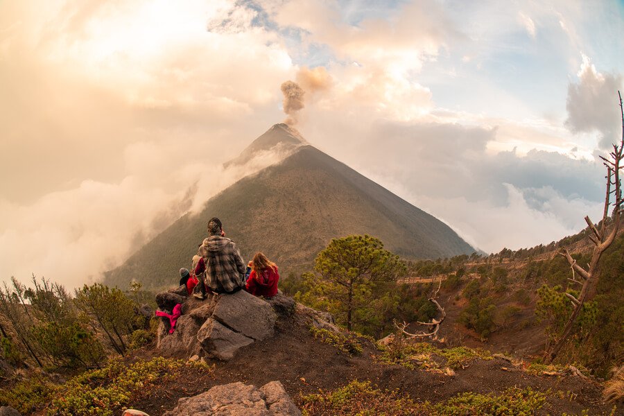 Travelers watching the active Fuego Volcano, Guatemala