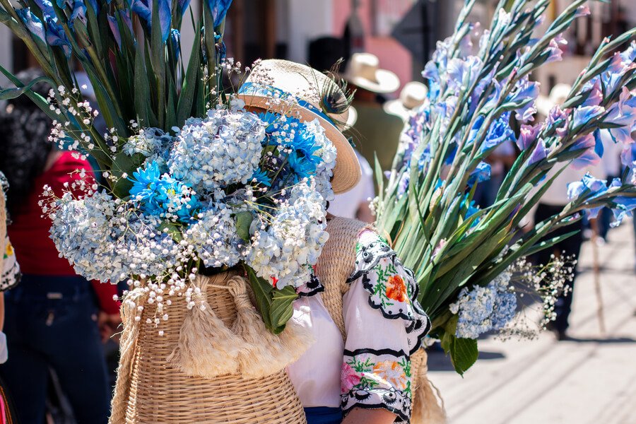 Traditional Guatemalan flower market with local artisan